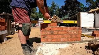 Bricklaying, raising a corner with lime mortar that feels like concrete!