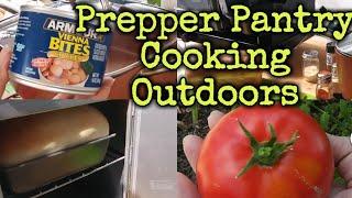 Prepper Pantry cooking outdoors/baking bread in Coleman camp oven