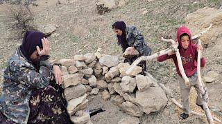 Shahla, empty-handed, fasting, and sick, tries to build a stone toilet for her children in the moun.