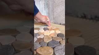 Installing a pebble shower floor #diy #tiling #howto #tile #construction #riverrock #pebbles