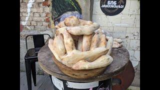 Baking traditional Georgian bread (Tonis Puri)