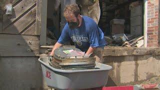 Volunteers go through historical archives damaged in Whitesburg, Kentucky