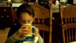 Tyson blowing bubbles in his hot chocolate