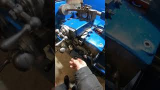 Vintage lathe carriage stop in action