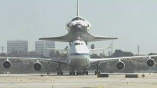 Space shuttle Endeavour flies a last lap of honour over Los Angeles before retirement