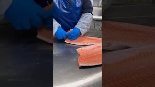 We watch how they machine fillet and debone salmon with minimal human intervention 