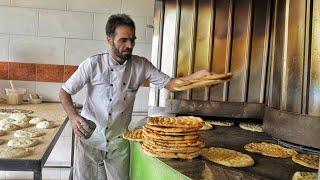 The beautiful movements of this baker with Barbari bread dough are really spectacular|baking bread