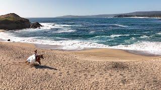 Bride rides a horse on the beach | Big Sur Elopement | Adventure Wedding Films