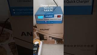 Anjing AJ-618E car battery charger on a used 12V car battery