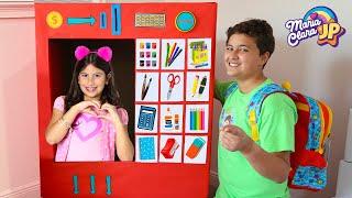 Maria Clara reuses her school supplies and plays in the giant vending machine with JP