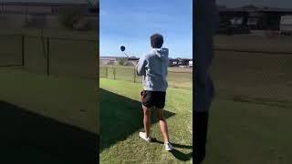 Hitting golf ball at storage facility