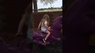 Lily climbing on her favorite  favorite dinosaur