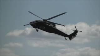 Black hawk and Augusta A109 attack firing guns