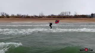 Kite Surfing In A winter Storm On Lake Michigan Around Michigan City Lighthouse 4K Drone Footage