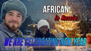 African in a Russian village  we are celebrating New Year