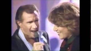 Bill Medley and Jennifer Warnes.  The Time Of My Life