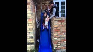 Erin, Lucy and Lily on the slide at Linda's "Farewell BBQ"