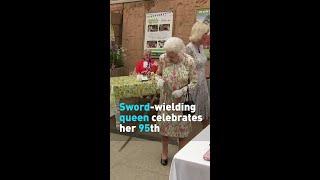 Sword-wielding Queen celebrates her 95th