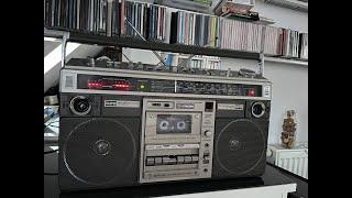 Hitachi TRK-8190E. Not only bulldozers, but Boomboxes too! Golden 80s 4ever. Playing Rod Stewart