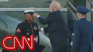 Trump stops to retrieve Marine's hat