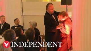 Tory MP Mark Field grabs female protester by neck