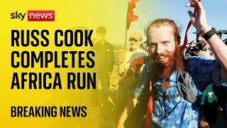 'Hardest Geezer' Russ Cook completes record-breaking run through Africa