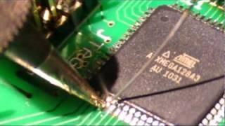 Soldering a TQFP 64-pin SMT package.