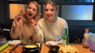 Ukrainian twin sister's reaction to eating spicy chicken feet for the first time