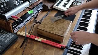 The CODA BOX by codahandmade. An electric tabletop percussion instrument.