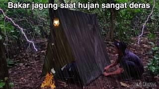 Camping in heavy rain in the forest during extreme weather until morning