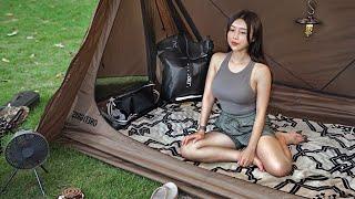 A girl camping alone in a tent that turns into a tarp and a house.