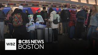 Holiday travelers face snow, ice delays at Logan Airport