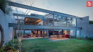 Family House Features An Exposed Metal Structure Which Doubles As Its Facade