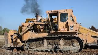 Cat D9H pushing 631E