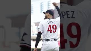 Johan Santana throws the first pitch to Joe Mauer in a Pablo López uni. 