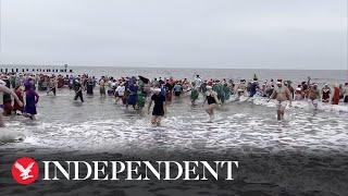 Swimmers run into cold Suffolk sea for Christmas swim