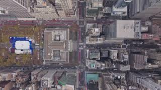 Aerial urban vista from a tripod, revealing Bryant Park, New York Public Library surrounded by