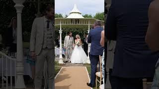 Bride and Groom walk up the aisle