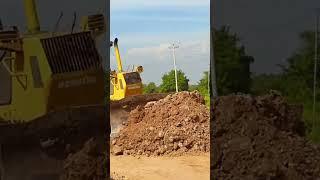 Skillful of bulldozer operator works on pushing the soil