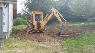 More grading with the Deere 310A Backhoe