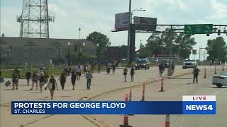 Protestors march through St. Charles