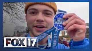 FOX 17's Sam Landstra runs the Reeds Lake Resolution Run