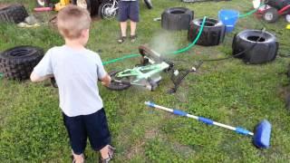 4 old Ryan running the pressure washer