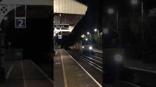 70815 & 70811 Pass Sway Railway Station on Platform 1 heading to Eastleigh East yard.