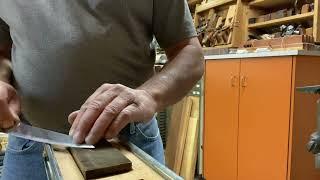 Sharpening a knife on a whetstone