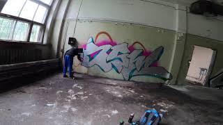 Graffiti bombing on an abandoned place with a crew boy. Experimenting and practice with tags