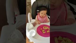 Baby Claire eating egg pancake