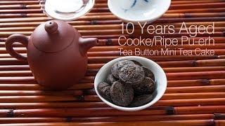 Pu erh-Steep 10 Year Aged Shu Pu-erh Tea-button(Ripe/Cooked Pu-erh) with Yixing Purple Clay Teapot