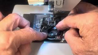 SINGER HEAVY DUTY-4423 REMOVING AND REPLACING THE BOBBIN CASE AND SETTING THE THREAD GAP (video 483)