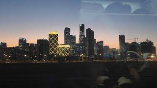 A magnificent sunset in China from a train window. Mesmerizing views of villages and towns